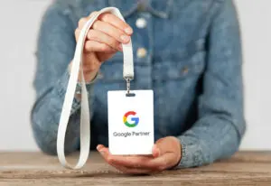 Person holding google partner lanyard for a blog about Why You Need a Google Partner SEO Agency
