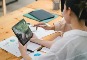 person on tablet for a blog about scalable growth