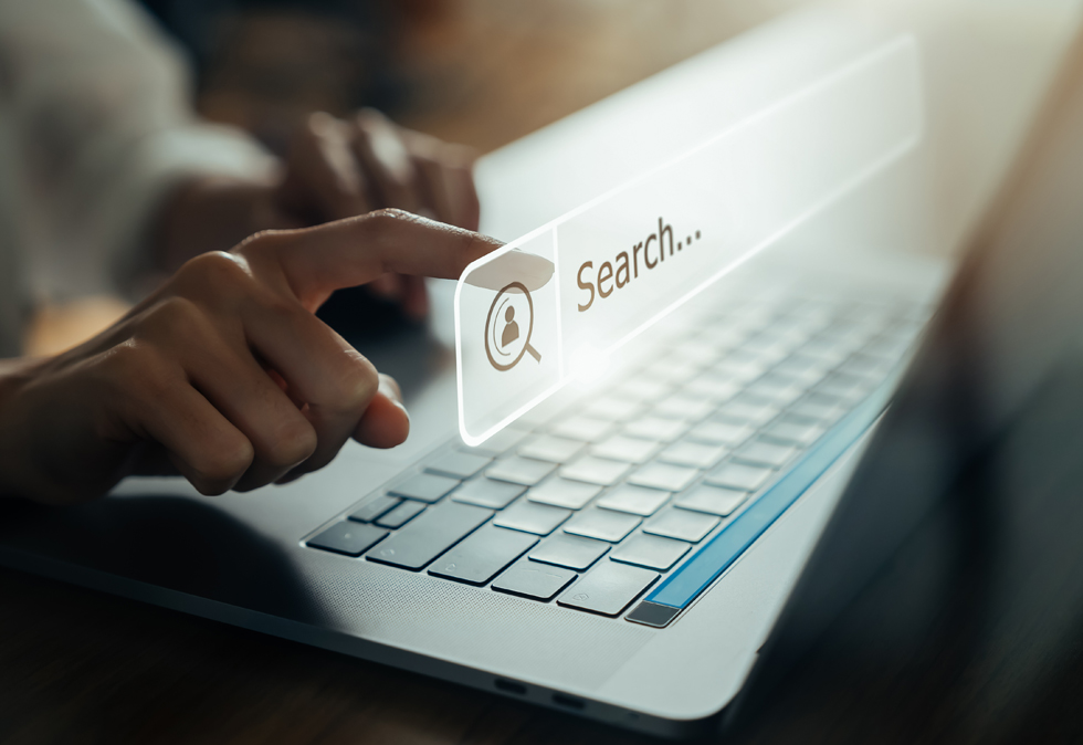 Persons hands working on keyboard for a blog about the future of seo with AI