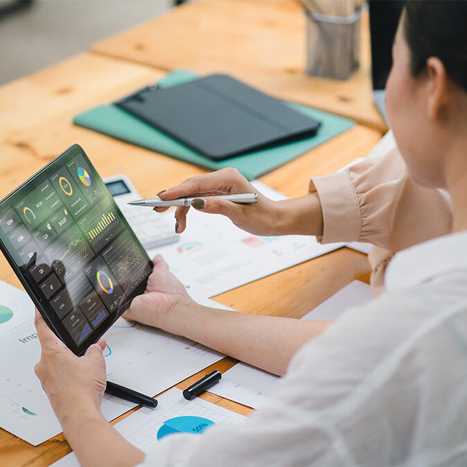 person on tablet for a blog about scalable growth, answer engine optimization agency